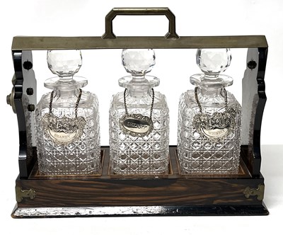 Lot 230 - Tantulus with Three Decanters with Silver Plated Labels