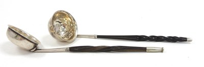 Lot 132 - Two Georgian silver toddy ladles, both with...