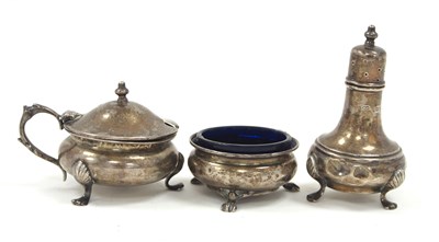 Lot 134 - A George V silver three piece condiment set...