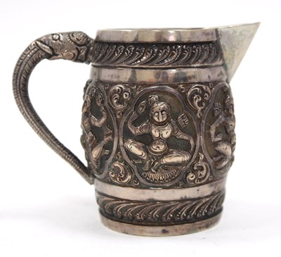 Lot 148 - An antique Indian silver milk jug of barrel...