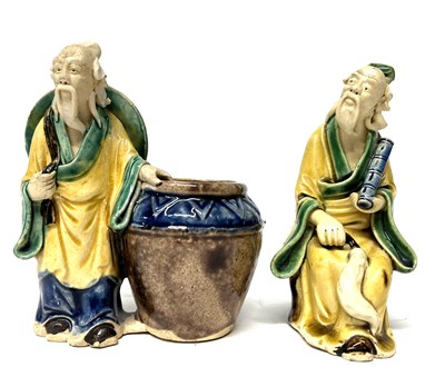 Lot 209 - A pair of Chinese pottery figures of...