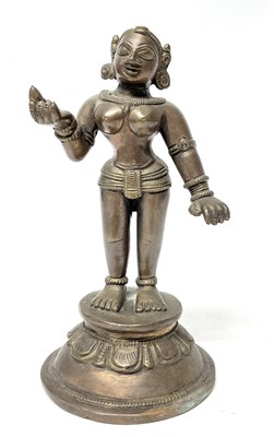 Lot 215 - An Indian bronze model of a dancer on shaped...