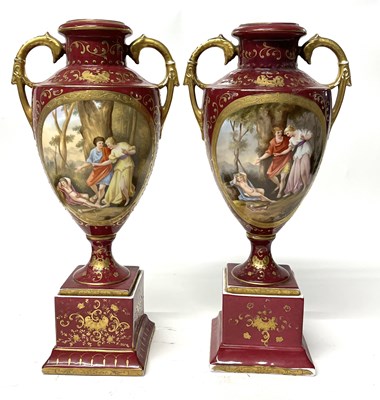 Lot 239 - A pair of Vienna style vases on square section...