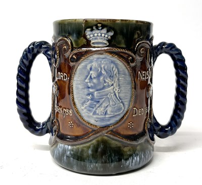Lot 240 - A Royal Doulton Nelson commemorative tyg circa...