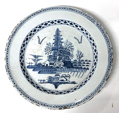 Lot 242 - An 18th Century English Delft dish with blue...