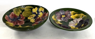 Lot 257 - A bowl decorated with anemones on a green...