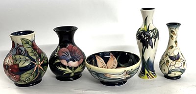 Lot 264 - A Moorcroft vase with a floral design together...
