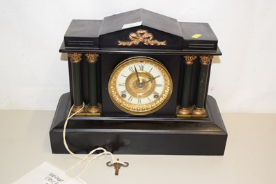 Lot 36 - A Victorian mantel clock in dark finish metal...