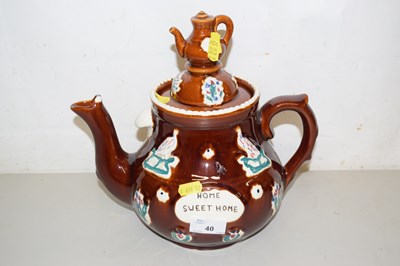Lot 40 - A 20th Century treacle glazed teapot marked...