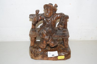 Lot 46 - A carved wooden model of a tramp