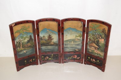 Lot 70 - A small lacquered trifold table top screen