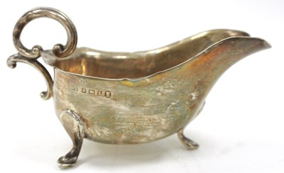 Lot 170 - A George V silver sauce boat of typical form...
