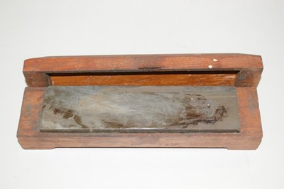 Lot 85 - A cased sharpening stone