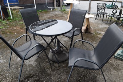Lot 228 - Glass-topped Patio Table and four Chairs