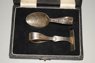 Lot 123 - A babies silver feeding spoon and food pusher