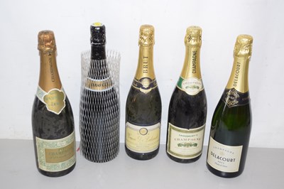 Lot 176 - A group of five bottles of champagne and...