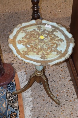 Lot 268 - A composition gilt effect wine table on tripod...