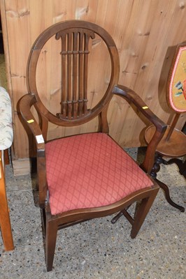 Lot 273 - An Edwardian oval back mahogany carver chair