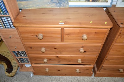 Lot 334 - A modern pine five drawer chest with turned...