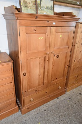 Lot 338 - A pine two door one drawer tall boy cabinet...