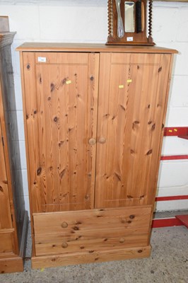 Lot 340 - A small pine two door, two drawer wardrobe