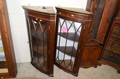 Lot 235 - A pair of glazed corner cabinets