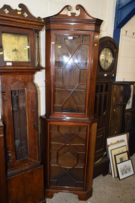 Lot 237 - An Edwardian floor standing mahogany corner...