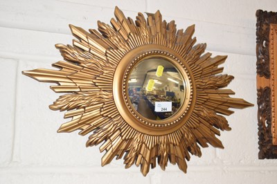 Lot 244 - A retro convex wall mirror in star shaped frame