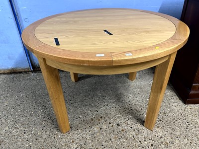 Lot 261A - A modern light wood extending dining table