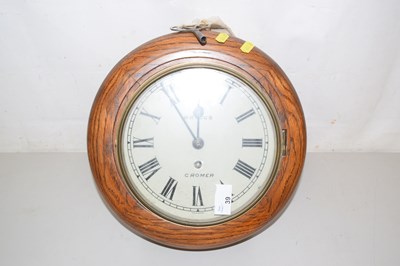 Lot 39 - A small oak cased wall clock, the face marked...
