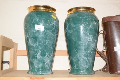 Lot 500 - A pair of green glazed and gilt decorated vases