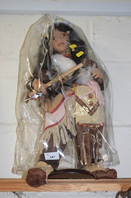 Lot 547 - An American Indian style doll