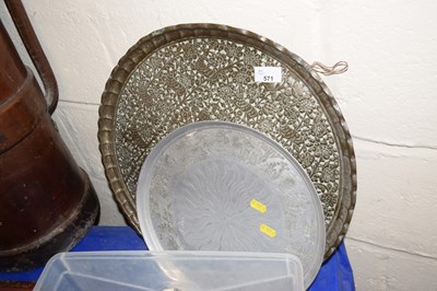 Lot 571 - A brass serving tray with embossed decoration...