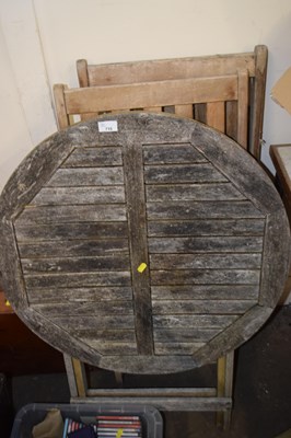 Lot 715 - A folding garden table and two chairs