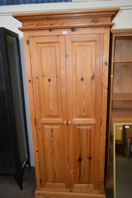 Lot 768 - A narrow pine two door wardrobe