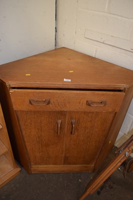 Lot 772 - A vintage G-Plan oak corner desk