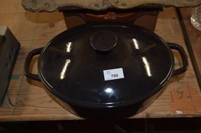 Lot 799 - An iron casserole pot