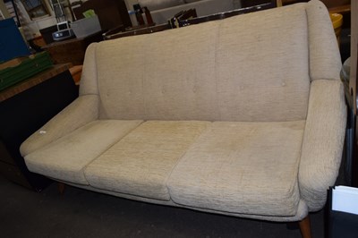 Lot 840 - A retro button back three seater sofa