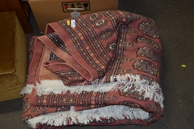 Lot 883 - A pink ground rug