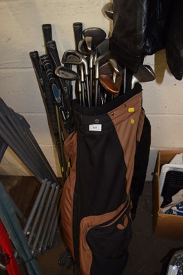 Lot 937 - A golf caddy and clubs