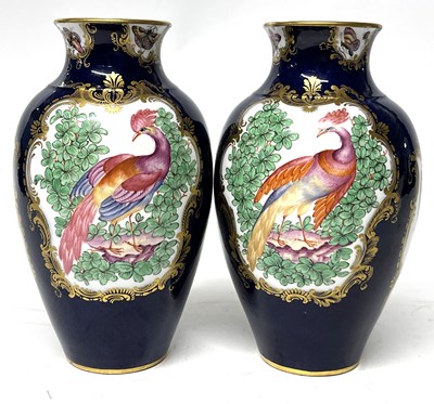 Lot 301 - A pair of porcelain vases decorated in...