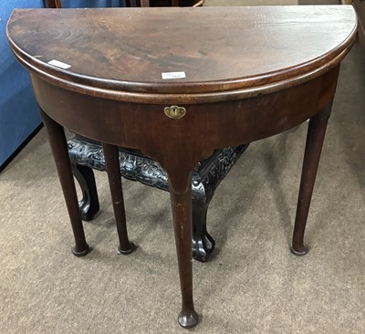Lot 362 - A Georgian mahogany D shaped tea table with...