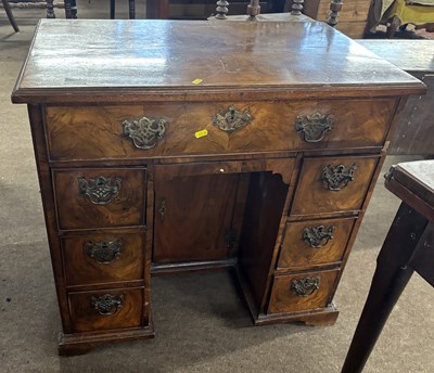 Lot 364 - A Georgian walnut kneehole desk with single...
