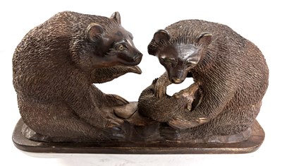 Lot 368 - A Black Forest style hardwood carving of two...