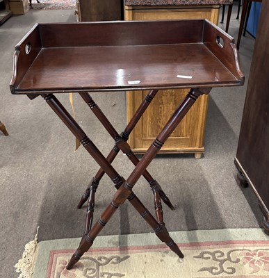 Lot 371 - A mahogany butlers tray on a folding turned...