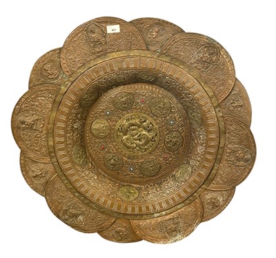 Lot 401 - A Chinese or Tibetan pressed copper and brass...