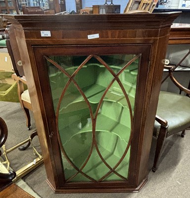 Lot 419 - A George III mahogany corner cabinet with...