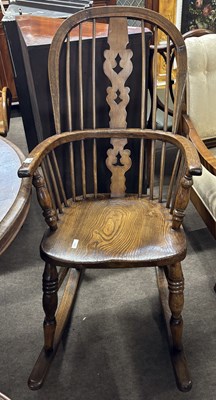 Lot 424 - A Victorian Windsor style rocking chair with...