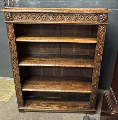 Lot 430 - A late Victorian oak bookcase with carved...