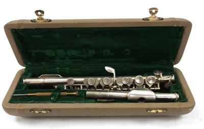 Lot 199 - A cased silver plated piccolo stamped Hsinghai,...